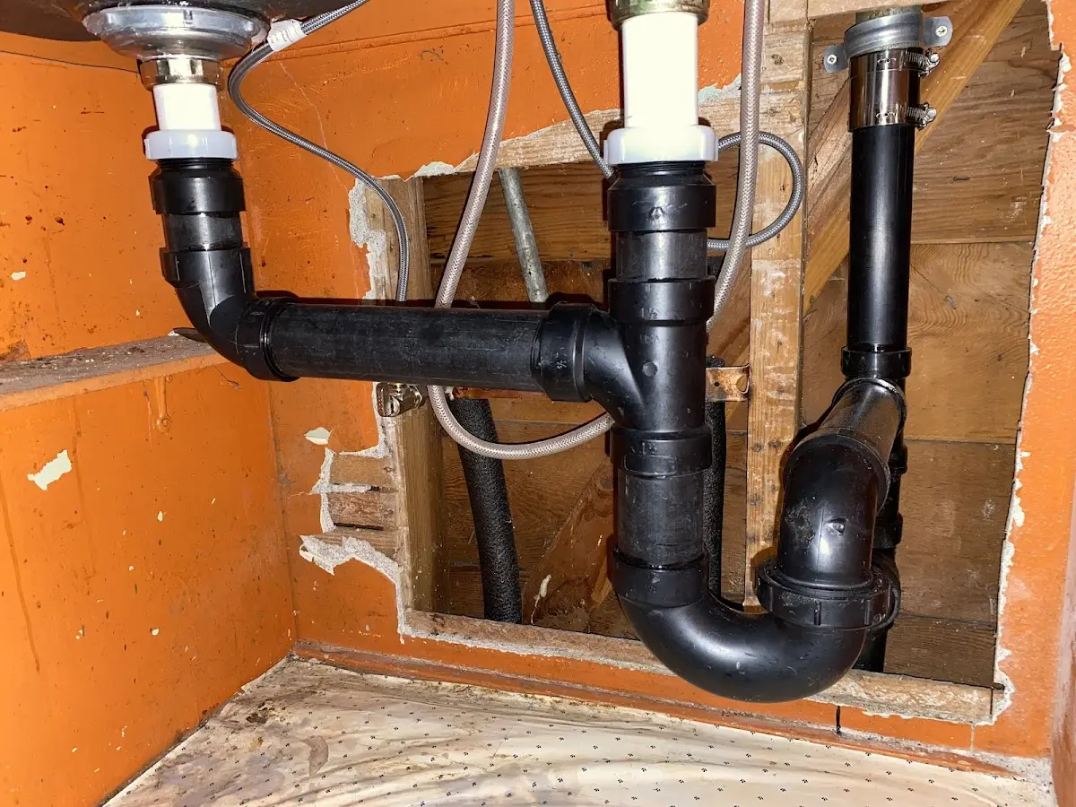 Professional Garbage Disposal Repair equipment and tools on the job in Burlington